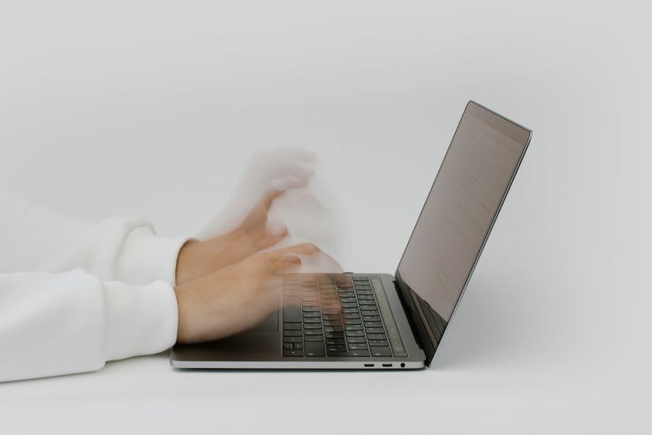 An image of a person typing on a laptop, symbolizing content writing and innovation.