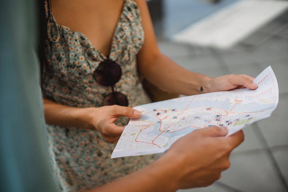 Image depicting a person using a map with influencers represented as landmarks