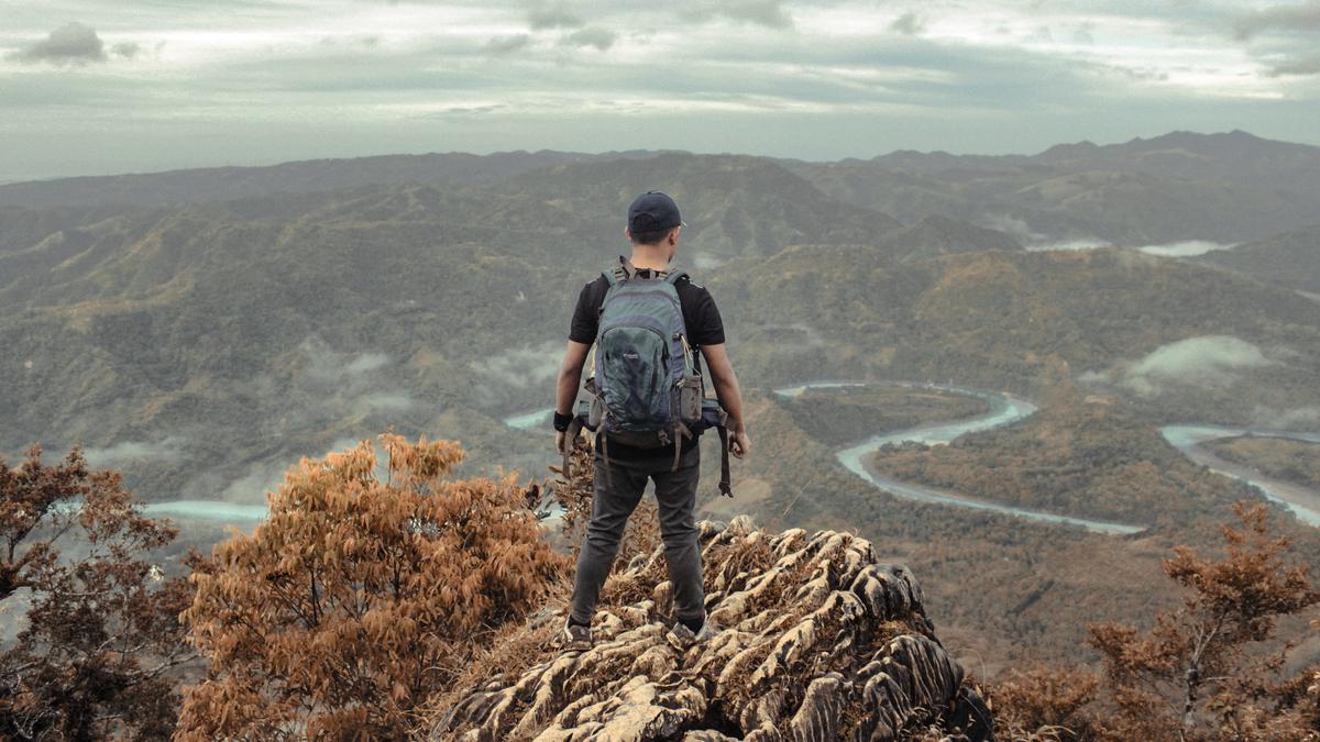 Image showing a person on top of a mountain, representing online success