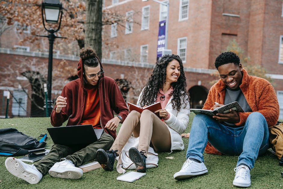 Image description: A group of people collaborating on a digital device, representing the topic of web content governance.