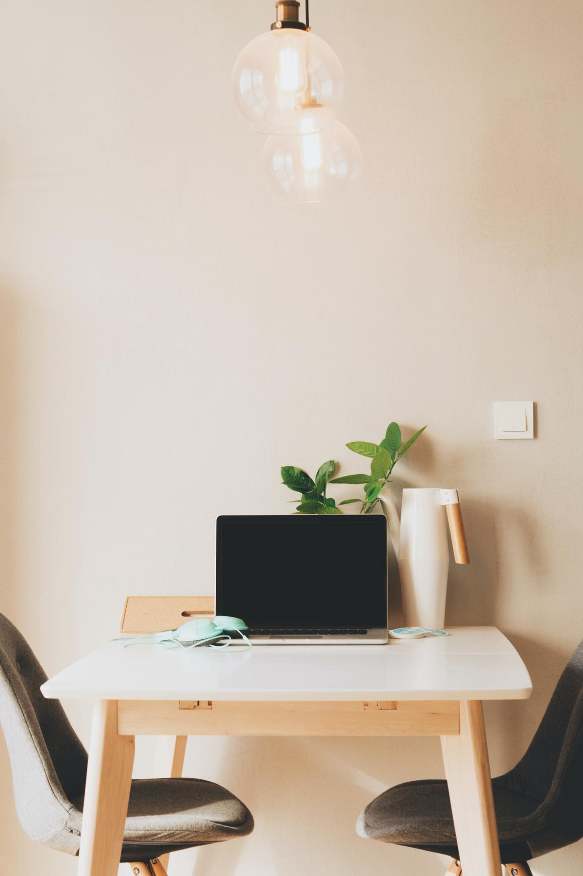 Picture of a person using a computer to manage a Writer Management System